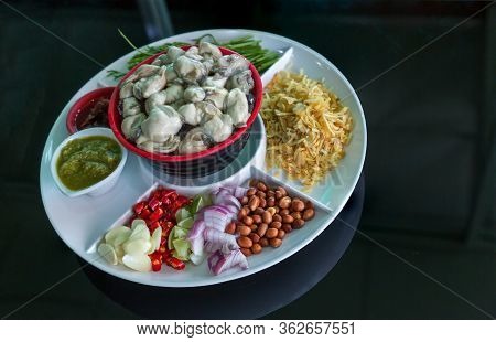 Oysters Food And Chili Sauce, Thai Food Is Oysters With Herbs Or Oyster Spicy Salad. Oysters With Ch