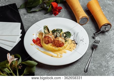 Mashed Potatoes With Cheese Balls In Sauce. Cheese Balls Breaded And Deep Fried. Deep-fried Cheese B