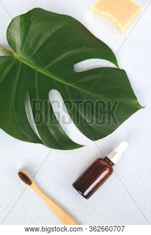 The Concept Of Zero Waste. Bamboo Toothbrush, Solid Shampoo And Serum