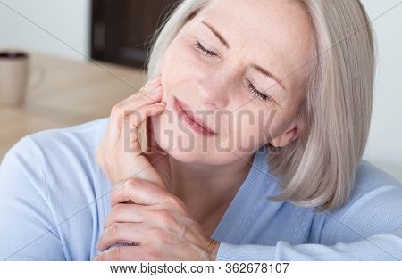 Teeth Problem. Woman Feeling Tooth Pain. Closeup Of Beautiful Middle-aged Suffering From Strong Toot