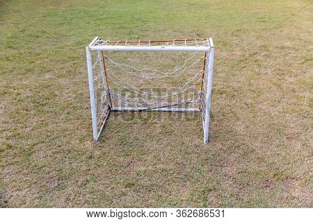 Mini Soccer Goal On The Green Grass Field. Outdoors Mini Football Court. Mini Football Goal.