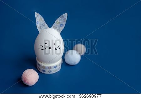Easter Holiday Concept With Cute Handmade Egg Bunny. Frame With Copy Space For Text. One Easter Egg 