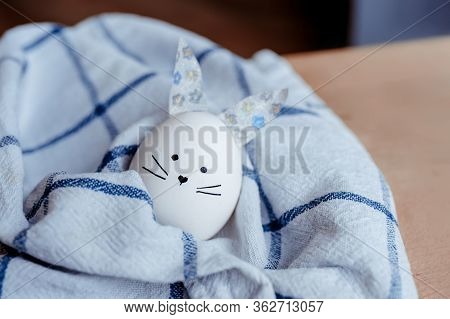 Easter Holiday Concept With Cute Handmade Egg Bunny. Frame With Copy Space For Text. One Easter Egg 