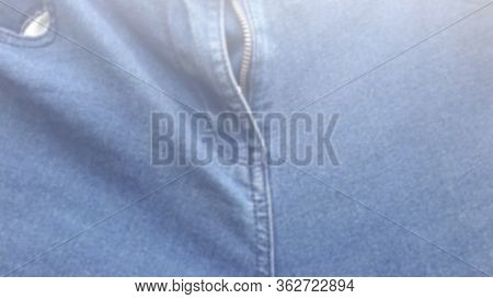 Blur Jeans Material. Defocused Denim Textire. Blue Fashion Background. Fabric Blurred Pattern.