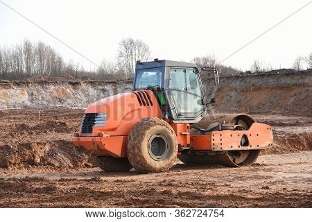 Vibration Single-cylinder Road Roller Leveling The Ground For The Foundation. Soil Compactor For Lay