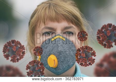Woman wearing a real anti-pollution and anti-viruses face mask outside. SARS COVID-19 pandemic concept
