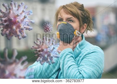 Woman wearing a real anti-pollution and anti-viruses face mask outside. SARS COVID-19 pandemic concept
