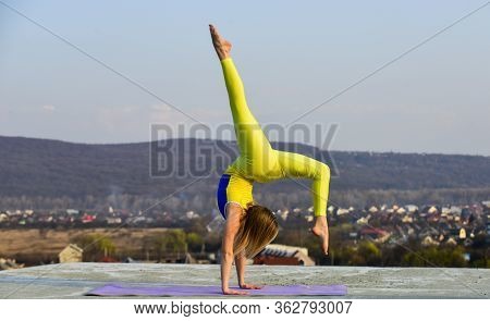 Gymnastics Athlete. It Never Gets Easier. Flexible Girl Outdoor. Woman Practicing Yoga. Stretching M