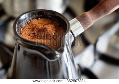 Close Up Coffee Foam In Jezve, Selective Focus.