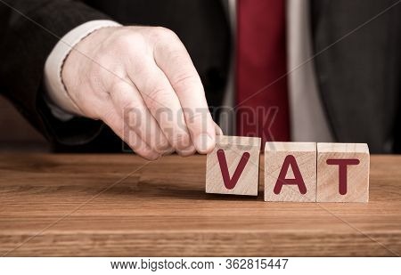 Value Added Tax Or Vat Concept With An Accountant Or Businessman Creating The Word Vat From Letters 