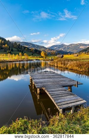 autumn pond under the mountains, Murau district,
Styria, Austria