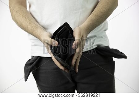 Caucasian Whites Mens Hands Show Empty Open Dlack Wallet And Empty Pants Pockets Turned Inside Out I