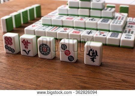 Kyiv, Ukraine - January 30, 2019: Selective Focus Of Rows And Pyramid Made Of Mahjong Game Tiles On 