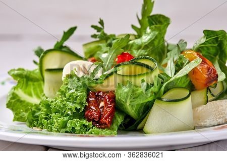 zucchini rolls with fresh salad