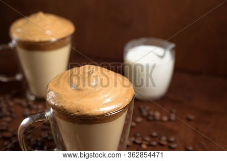 Cold Dalgon Coffee In Clear Glasses On A Dark Wooden Background. Foam From Sugar And Instant Coffee 