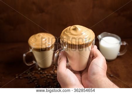 Cold Dalgon Coffee In Clear Glasses On A Dark Wooden Background. Foam From Sugar And Instant Coffee