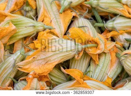 Fresh Zucchini Flowers At A Farmers Market In Italy