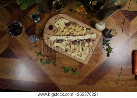 Wooden Plateau With Fresh Grapes Figs And Types Of Cheese Closeup As Homefood Background Top View
