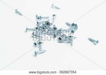 Metal Screws 16 Mm Long Bolts For Furniture On A White Background