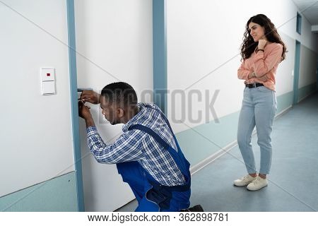 Lockpicker Opening Home Door For Locked Out Woman