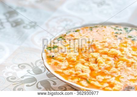 Plate Of Tomato Soup With Lane Kluski Noodles.