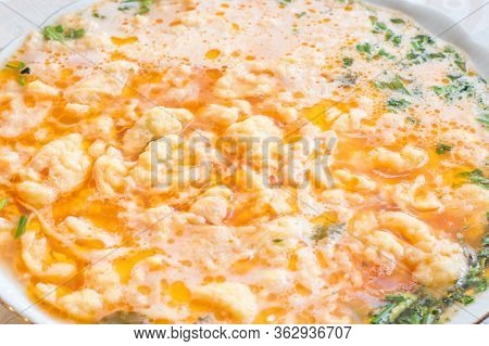 Close-up On Tomato Soup With Lane Kluski Noodles.