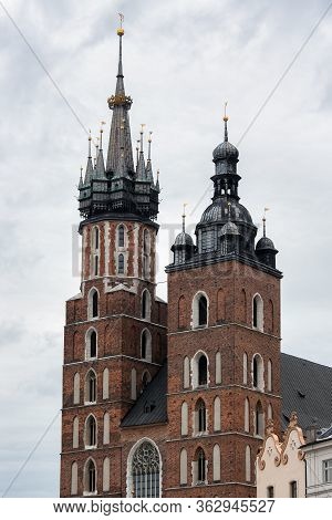 Two Different Towers Of St Marys Church, Kosciol Mariacki, At The Main Market Square, Rynek, In Crac