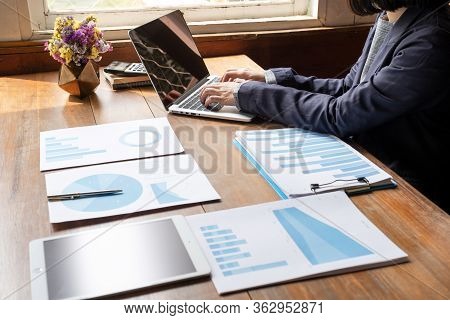 Business Woman Working At Home With Her Laptop And Tablat.