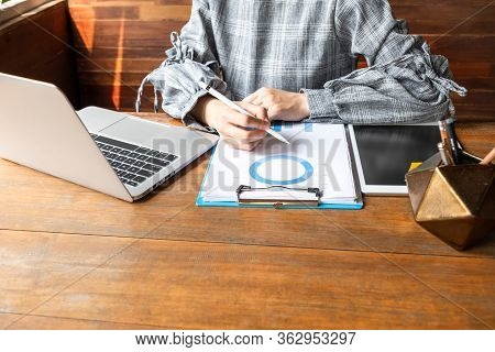 Business Woman Working At Home With Her Laptop And Tablat.