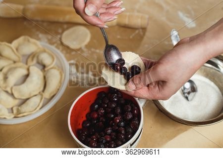 Cooking Homemade Dumplings, Female Hands Sculpting Dumpling Closeup
