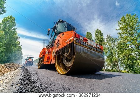 Heavy Vibration Roller At Asphalt Pavement Works. Road Repairing.