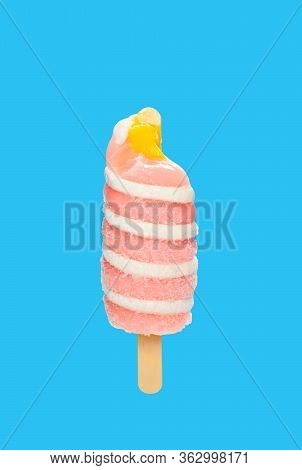 Mango Flavor Popsicle With Some Bites On A Blue Background