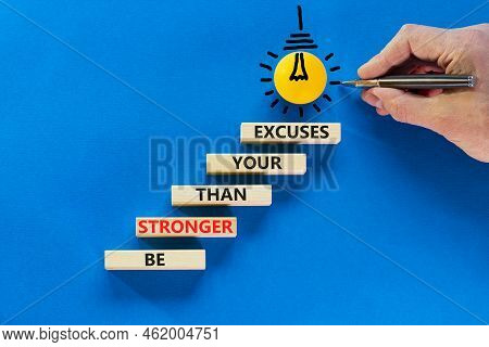 Be Stronger Symbol. Concept Words Be Stronger Than Your Excuses On Wooden Blocks On A Beautiful Blue