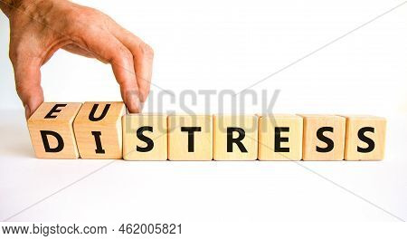 Eustress Or Distress Symbol. Psychologist Turns Cubes And Changes The Concept Word Eustress To Distr