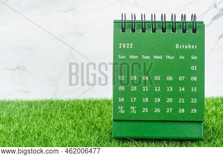 Green October 2022 Monthly Desk Calendar For 2022 Year On Grass.