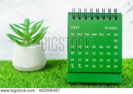 Green October 2022 Monthly Desk Calendar For 2022 Year On Grass.