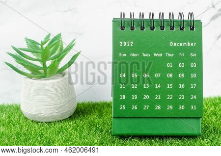 Green December 2022 Monthly Desk Calendar For 2022 Year On Grass.