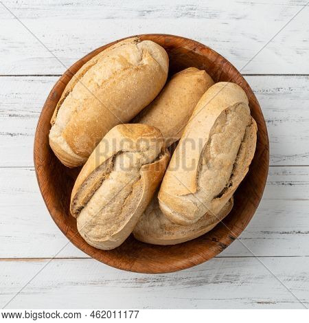 Whole Grain French Bread, Salt Bread Or Pistolet In A Bowl Over Wooden Table.