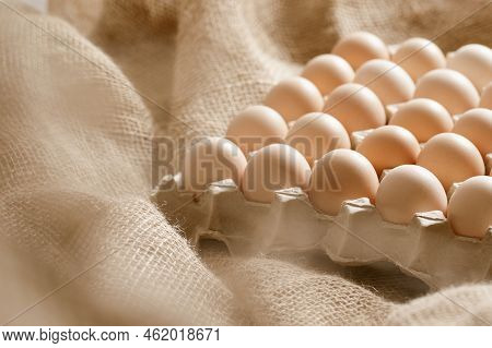 Fresh Organic Chicken Eggs In Carton Pack Or Egg Paper Container On A Sacking. Zero Waste Packaging 