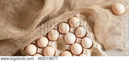 Fresh Organic Chicken Eggs In Carton Pack Or Egg Paper Container On A Sacking. Zero Waste Packaging 
