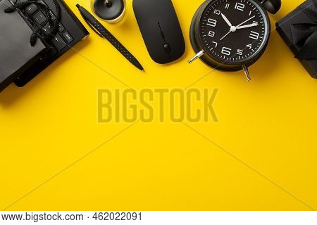 Black Friday Sale Concept. Top View Photo Of Black Giftbox Paper Bag Alarm Clock Pen Candle Computer