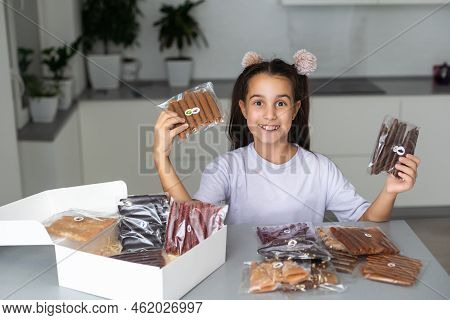Little Girl With A Box Of Pastilles