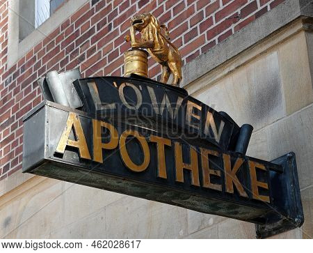 Rheine, Nrw, Germany - August 24 2022 Shield Of The Lion Pharmacy, Called Löwen Apotheke With A Gold