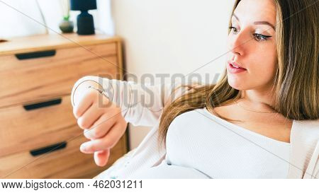 Pregnant Clock Time Childbirth. Childbirth Time, Contractions Pain. Pregnancy Woman Watching Clock, 