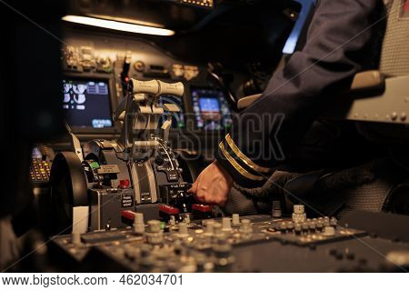 Woman Airliner Pushing Dashboard Buttons In Plane Cockpit, Preparing To Takeoff With Engine Lever Or