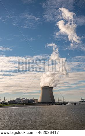 Antwerpen, Flanders, Belgium - July 10, 2022: Portrait, Sunset On Cooling Towers And Doel Nuclear Po