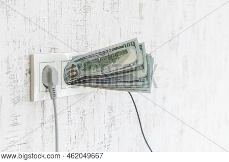 Socket And Switch In The Wall. 100 Is In It. Tariff Growth. Saving Electricity