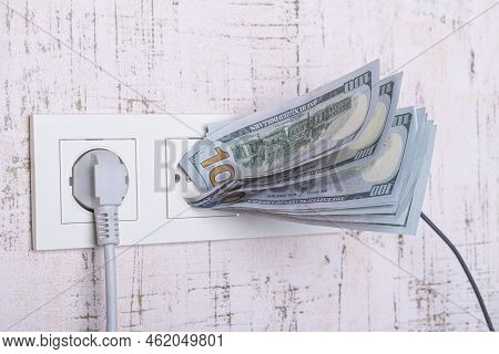 Socket And Switch In The Wall. 100 Is In It. Tariff Growth. Saving Electricity