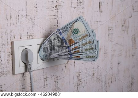Socket And Switch In The Wall. 100 Is In It. Tariff Growth. Saving Electricity