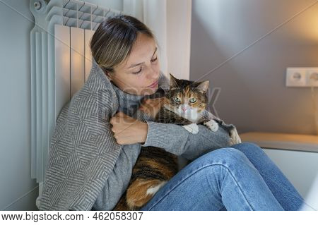 Young Woman Hugs Domestic Pet Enjoying Spending Time With Favourite Cat. Animal Makes Owner Happy An
